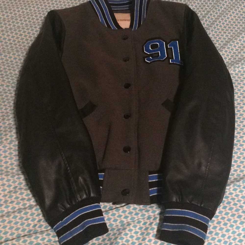 Grey and blue with leather sleeves